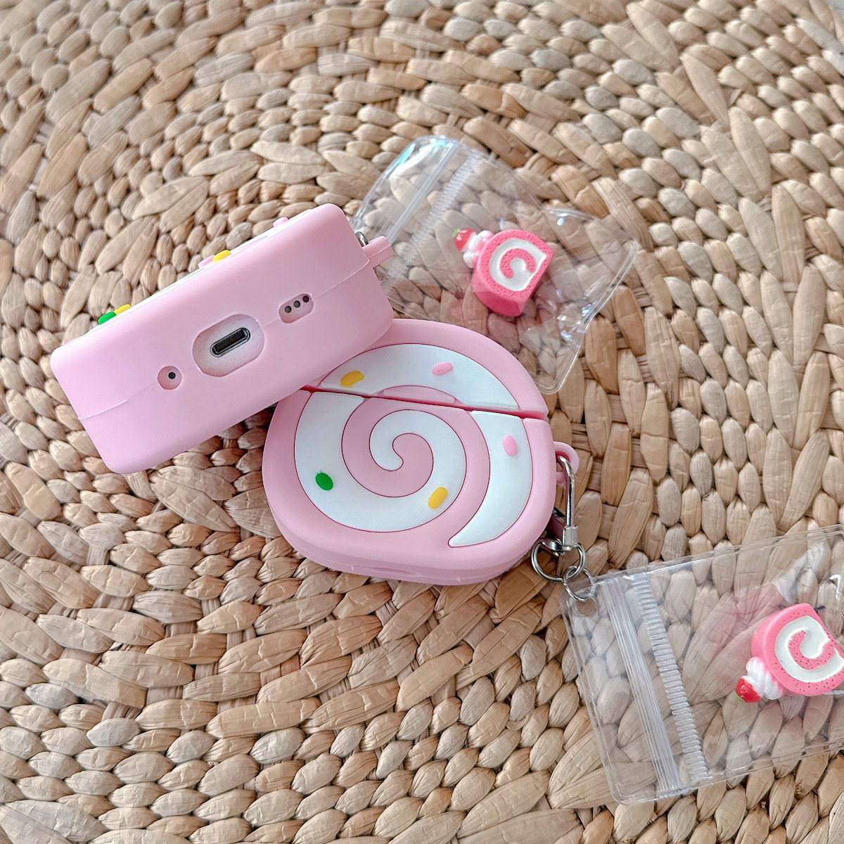 Pink Swiss Roll-shaped AirPods case - ChildAngle