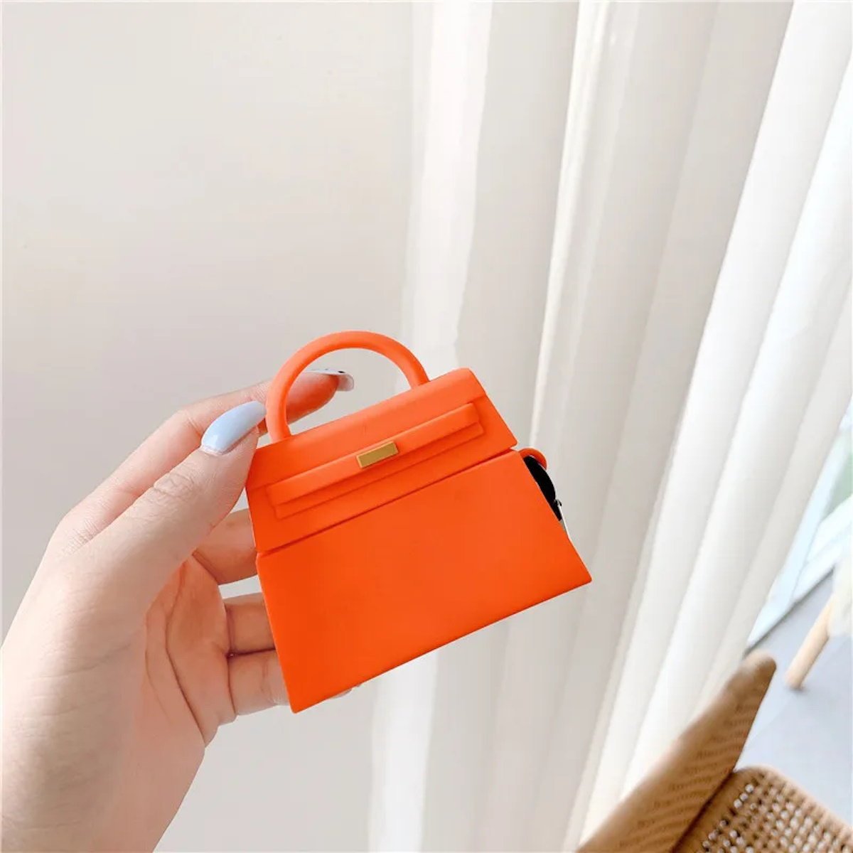 orange and a black handbag-shaped air pod case - ChildAngle Birkin AirPods Case