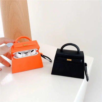orange and a black handbag-shaped air pod case - ChildAngle Birkin AirPods Case