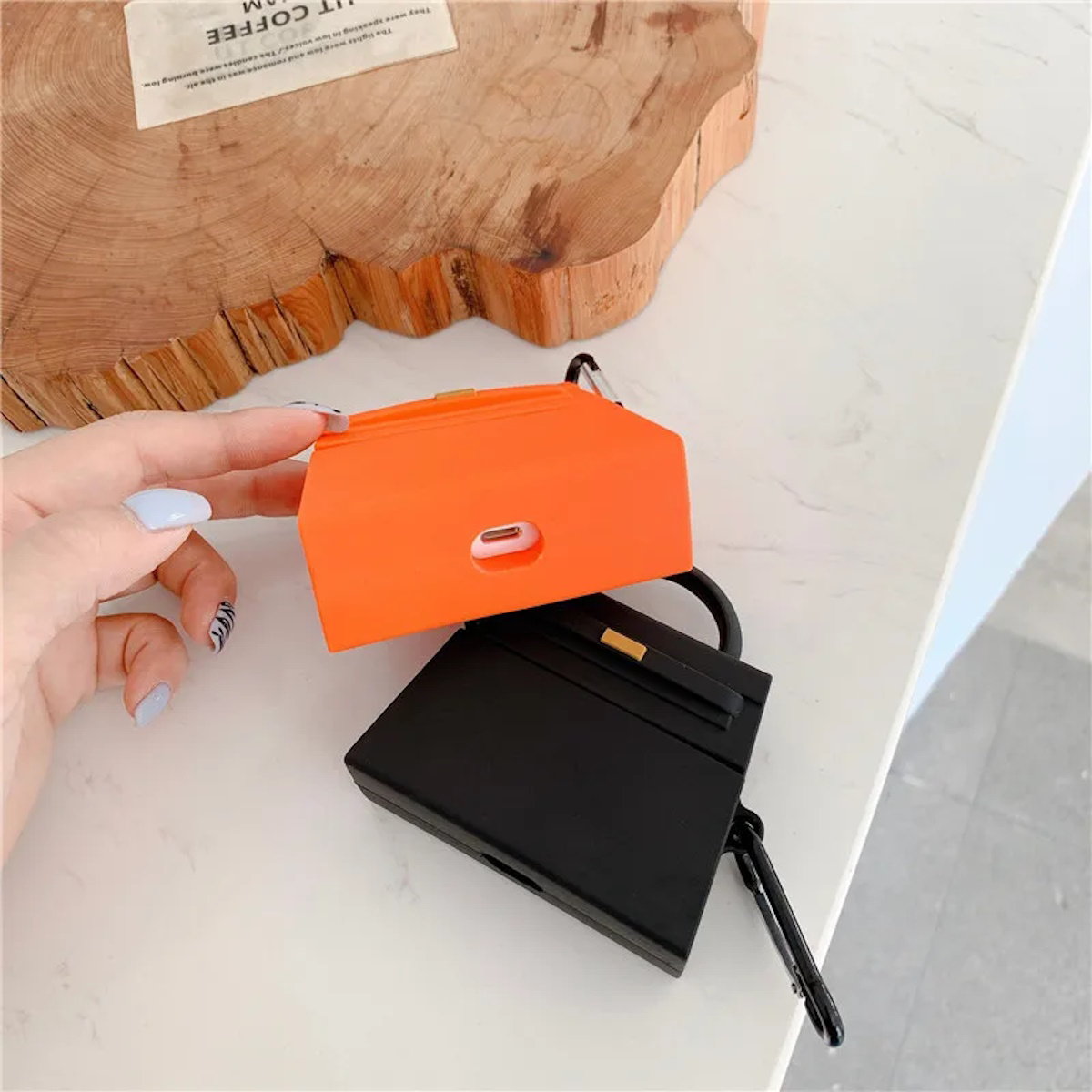 orange and a black handbag-shaped air pod case - ChildAngle Birkin AirPods Case