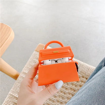 orange and a black handbag-shaped air pod case - ChildAngle Birkin AirPods Case