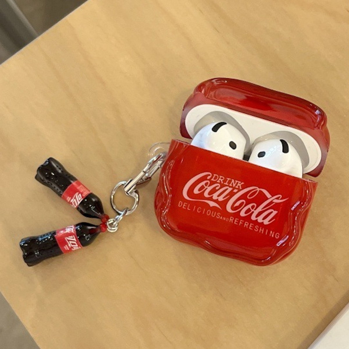 Red Coca-Cola AirPods case - ChildAngle