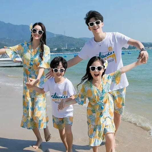 Family of four in matching outfits on a beach Pineapple Family Matching Outfits - ChildAngle