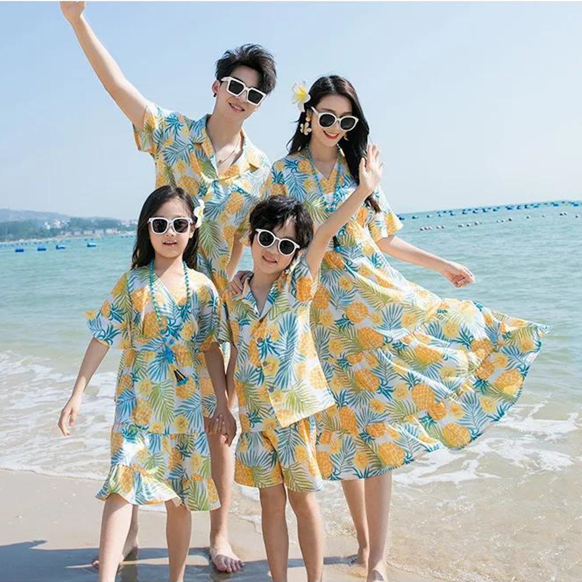 Family of four wearing matching pineapple print dresses  Pineapple Family Matching Outfits - ChildAngle