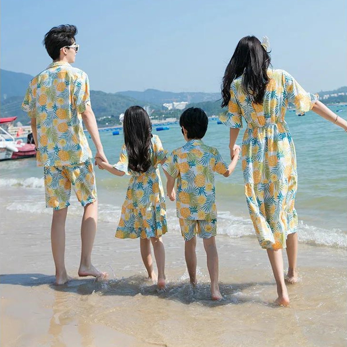 Family of four wearing matching yellow and blue patterned outfits walking  Pineapple Family Matching Outfits - ChildAngle