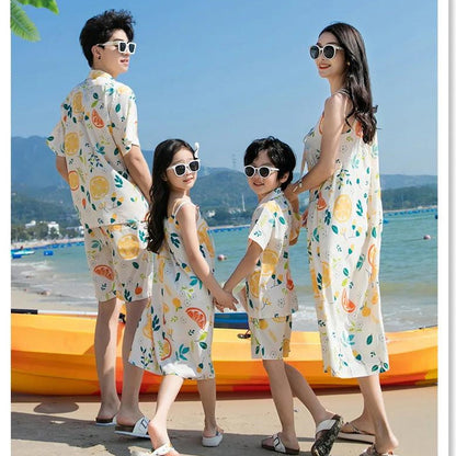 Family of four wearing matching outfits with fruit patterns  - ChildAngle Family Matching Outfits Set