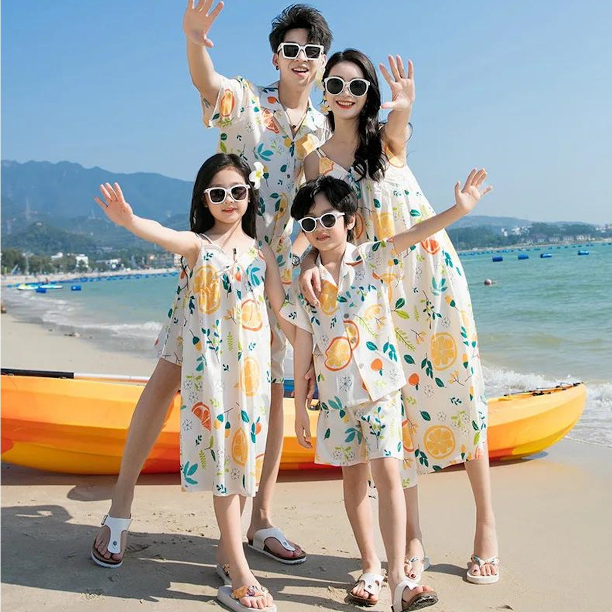 Family of four posing with colorful fruit-patterned dresses  - ChildAngle Family Matching Outfits Set