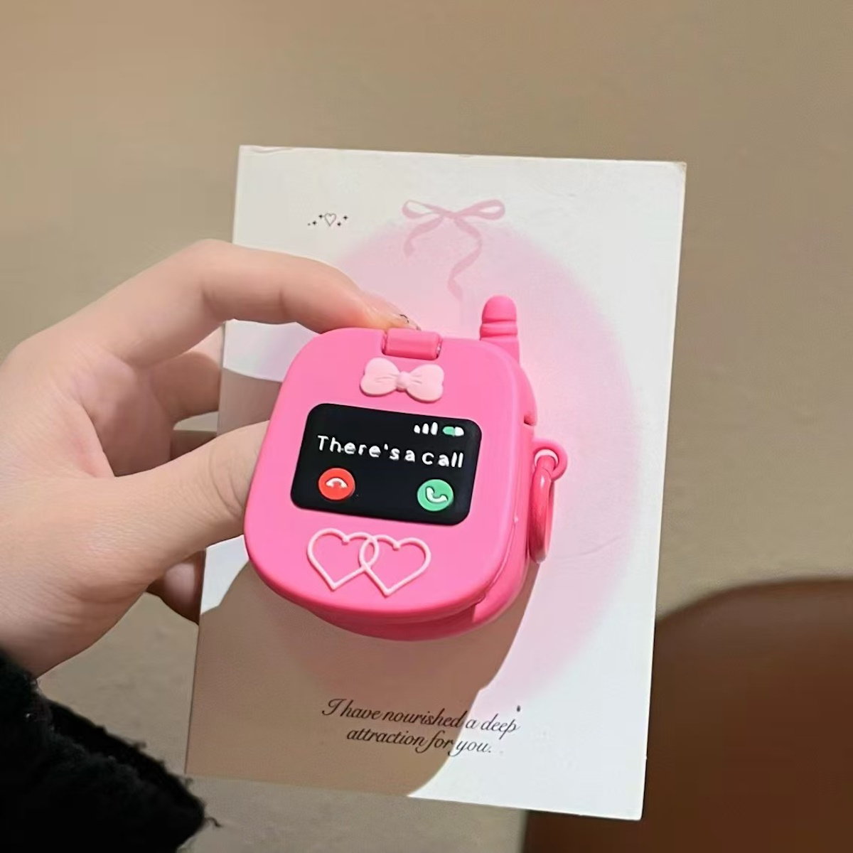 Pink toy phone AirPods case - ChildAngle