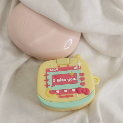 Yellow toy phone AirPods case - ChildAngle