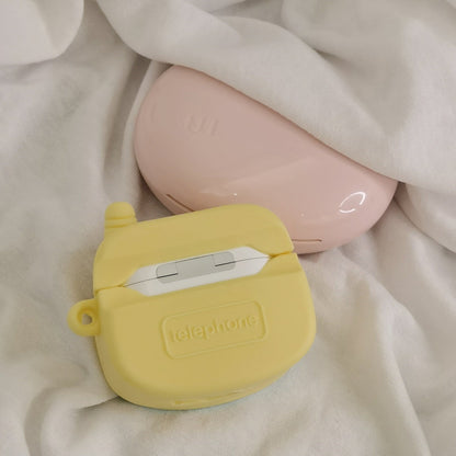 Yellow toy phone AirPods case - ChildAngle