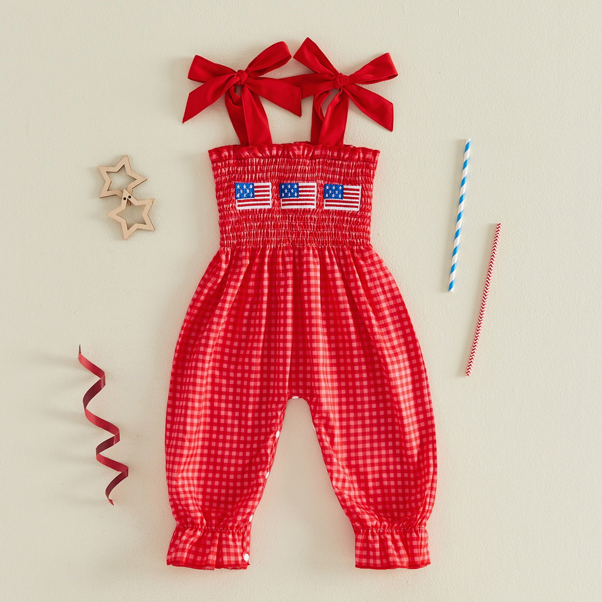 Child in a red checkered outfit with American flags - ChildAngle 4th of July Baby Romper