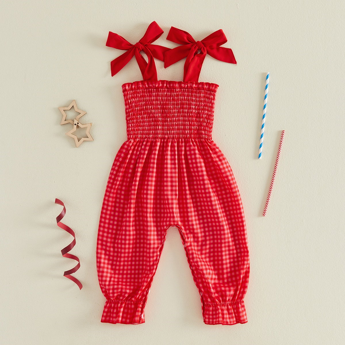 Child in a red checkered outfit with American flags - ChildAngle 4th of July Baby Romper