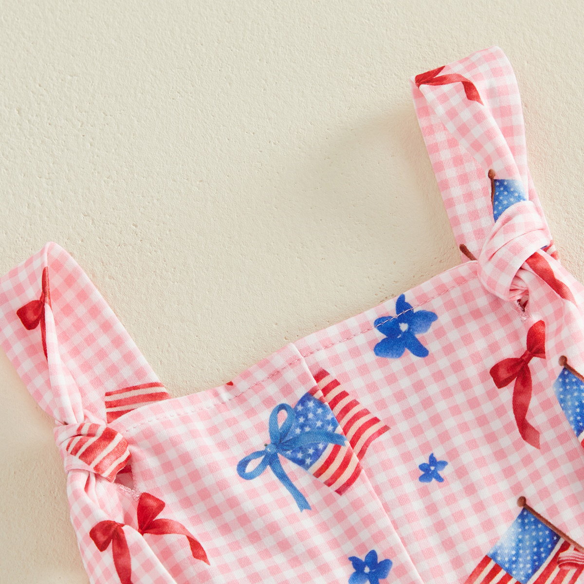 Child wearing a white outfit with red and blue floral patterns - ChildAngle Toddler 4th of July Outfits Shoulder Tie Jumpsuit