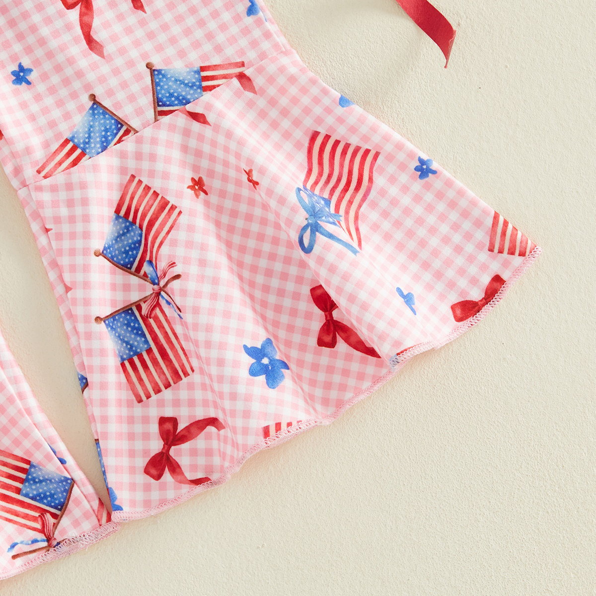 Child wearing a white outfit with red and blue floral patterns - ChildAngle Toddler 4th of July Outfits Shoulder Tie Jumpsuit