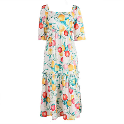 Dress with fruit pattern on a white background