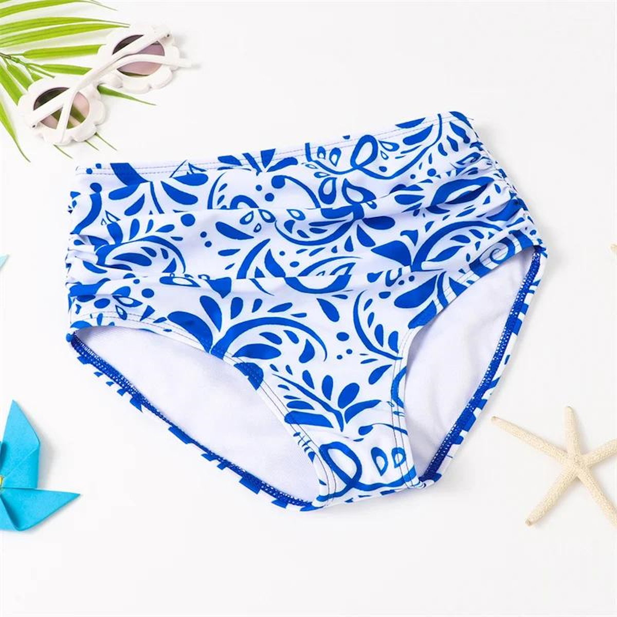 Blue and white swim bottoms with a floral pattern - ChildAngle