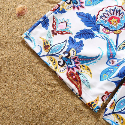 Colorful patterned fabric on a sandy surface