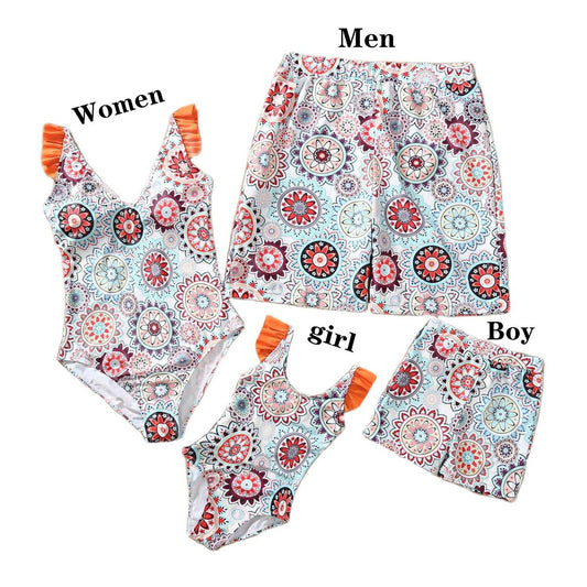Colorful patterned swimsuits for men, women, girl, and boy on a white background.