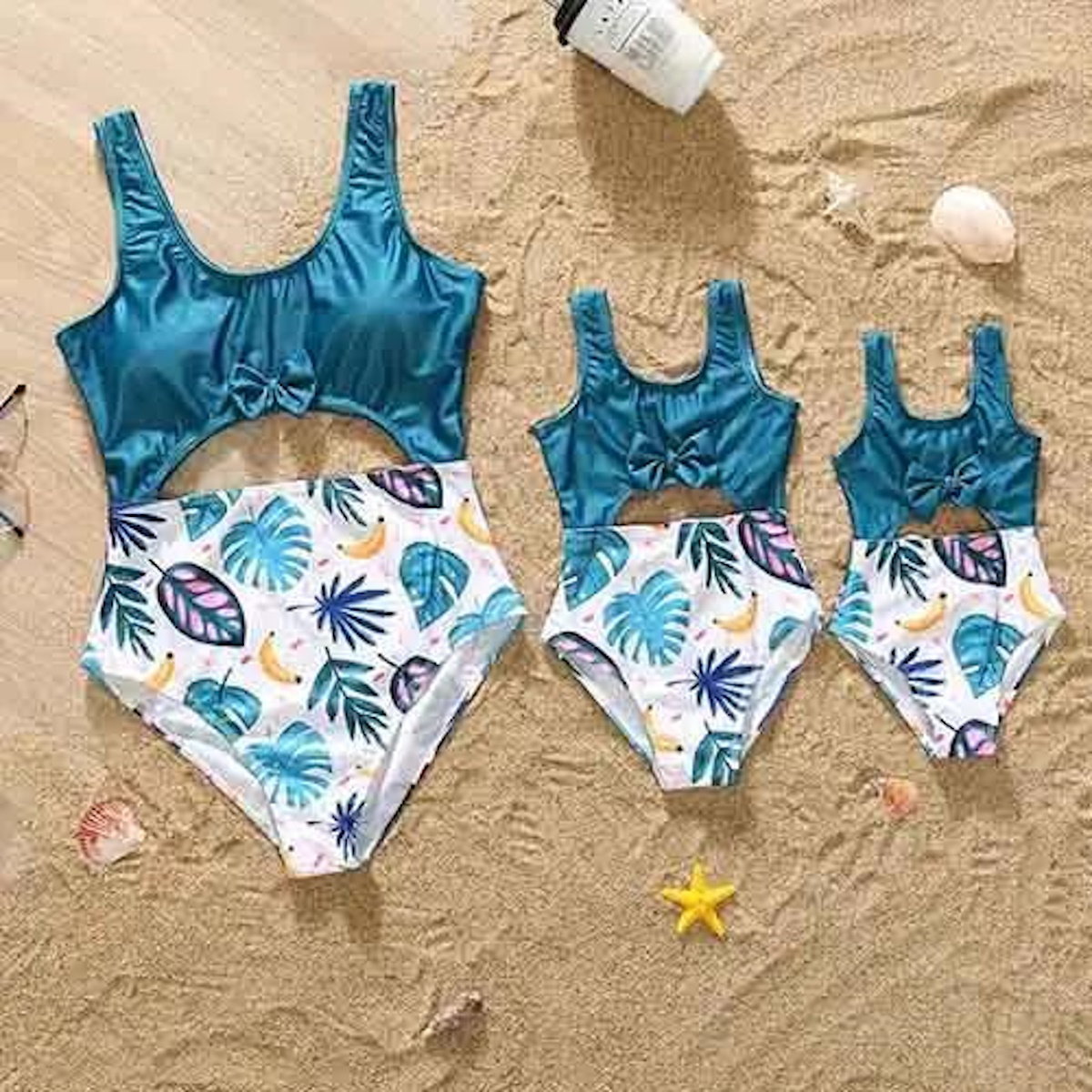 Three blue swimsuits with tropical leaf patterns One Piece Palm Leaves Swimsuits for Mom and Daughter - ChildAngle
