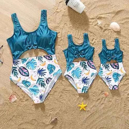Three blue swimsuits with tropical leaf patterns One Piece Palm Leaves Swimsuits for Mom and Daughter - ChildAngle