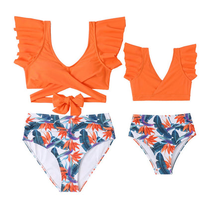 Orange bikini top with ruffled details and tropical leaf patterned bottoms - ChildAngle