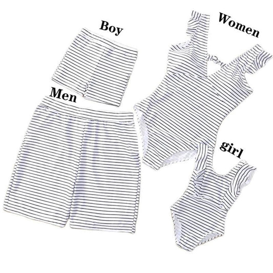 Striped clothing set for men, boys, women, and girls on a white background