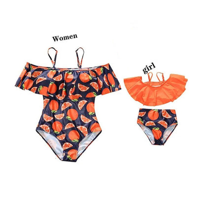 Women's and girl's swimsuits with watermelon pattern on a white background