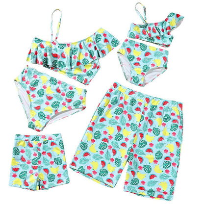 Children's swimwear set with fruit and leaf pattern on a white background