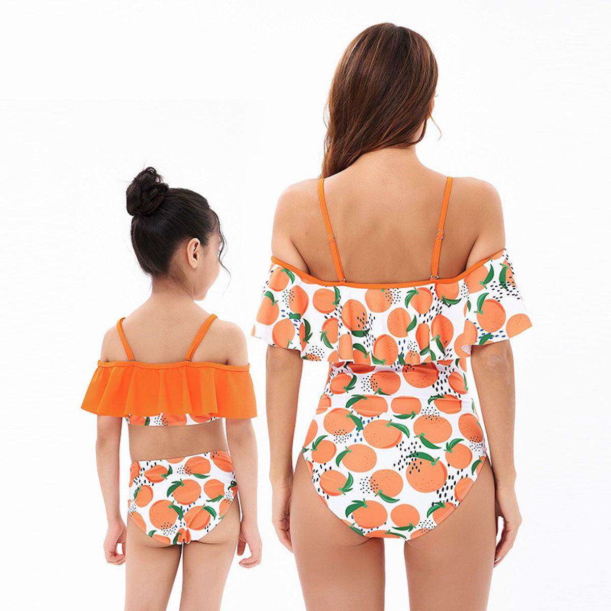 Two people wearing matching swimsuits with orange and white pattern - ChildAngle