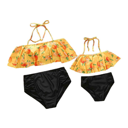 Two-piece swimsuit with orange floral top and black bottoms - ChildAngle