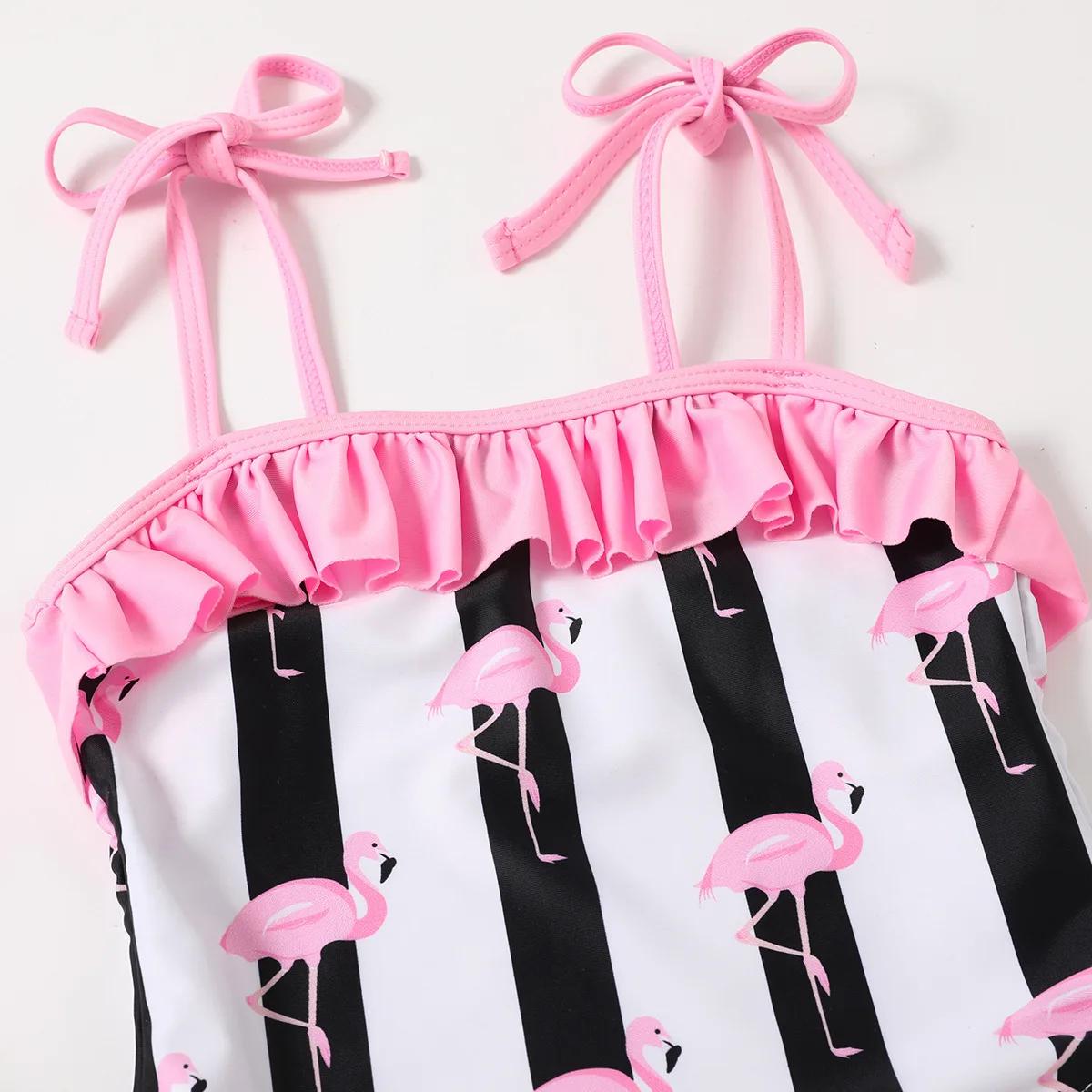Pink bikini top with ruffled details and flamingo-patterned black and white pants - ChildAngle