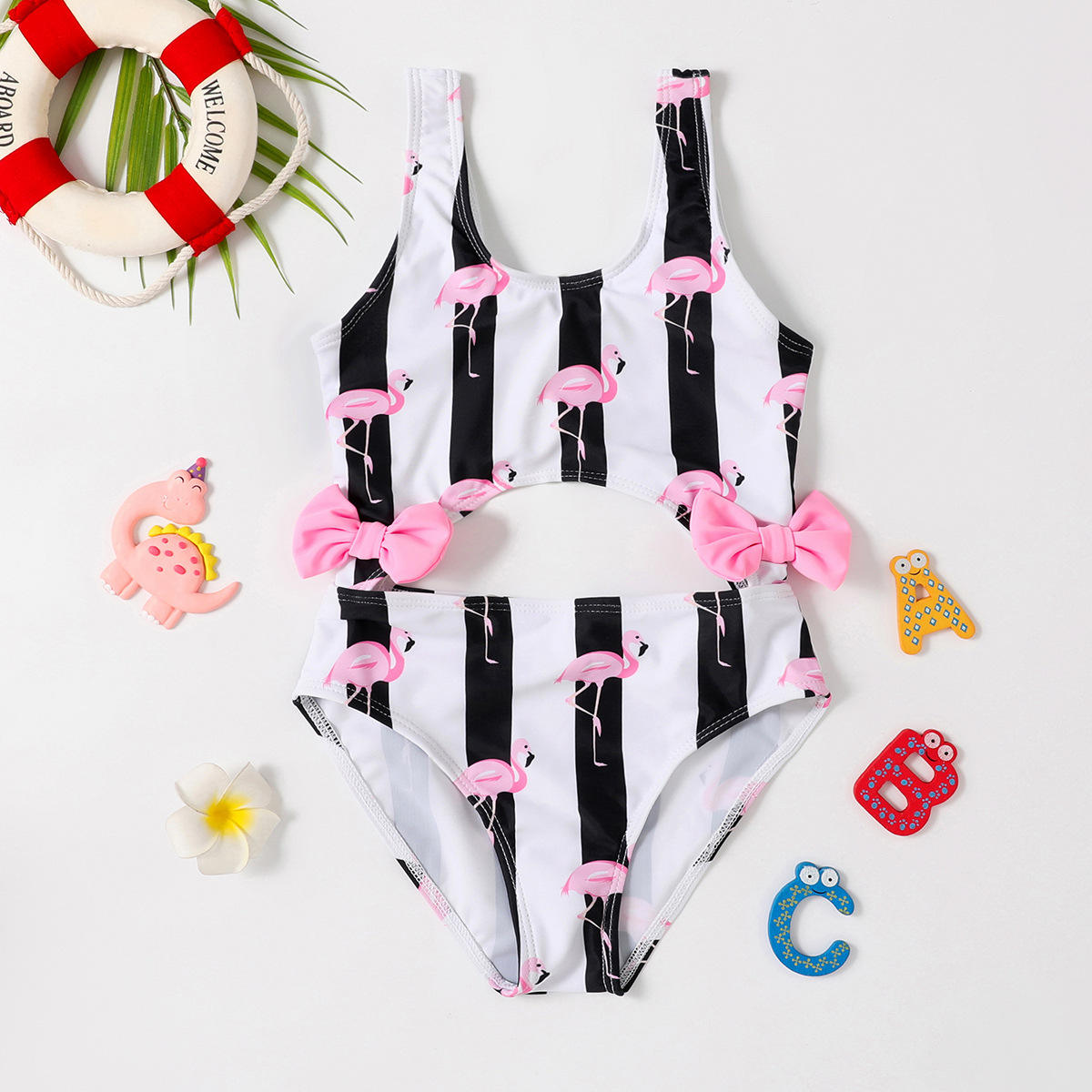 Black and white striped swimsuit with pink flamingo and bow details - ChildAngle