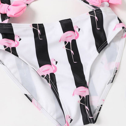 Black and white striped swimsuit with pink flamingo design - ChildAngle
