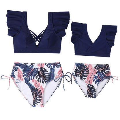 Navy blue bikini top with ruffled straps and tropical leaf patterned bottoms Mommy and Me Matching Bikini Set - ChildAngle