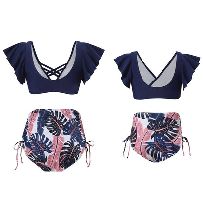 Navy blue bikini top with ruffled sleeves and tropical leaf patterned bottoms Mommy and Me Matching Bikini Set - ChildAngle
