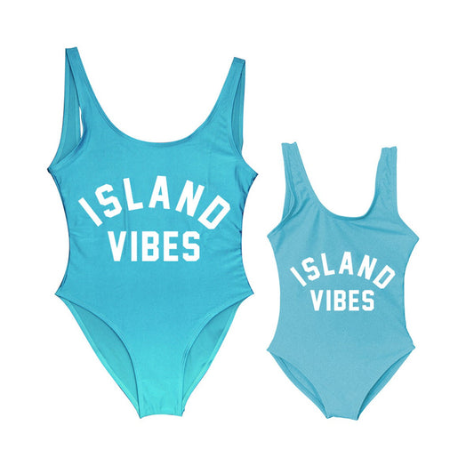 Two turquoise swimsuits with 'ISLAND VIBES' text Mommy and Me One Piece Swimsuits - ChildAngle
