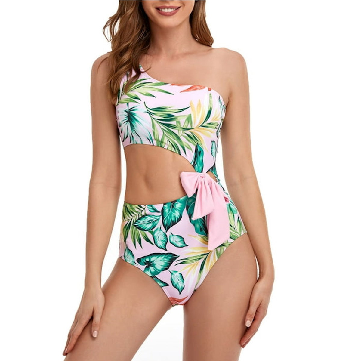 Woman wearing a tropical leaf print bikini with a pink bow - ChildAngle