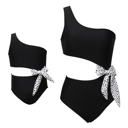 Black one-shoulder swimsuit with white polka dot ties - ChildAngle