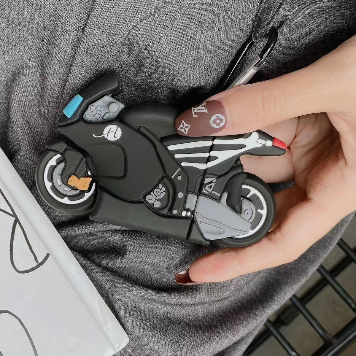 Black motorcycle AirPods Case - ChildAngle