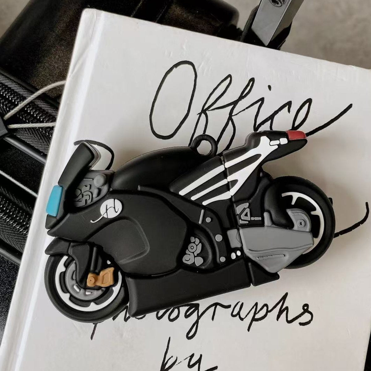 Black motorcycle AirPods Case - ChildAngle