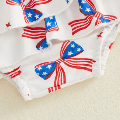 White Tiered Shorts Baby Romper with red, white, and blue 4th of July bow pattern - ChildAngle