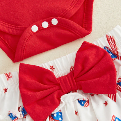 Red baby outfit with a large bow on white tiered shorts for the first 4th of July - ChildAngle