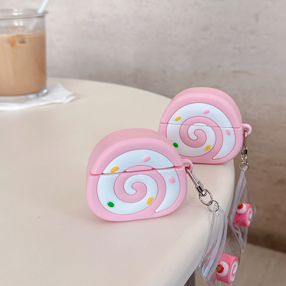 Pink Swiss Roll-shaped AirPods case - ChildAngle