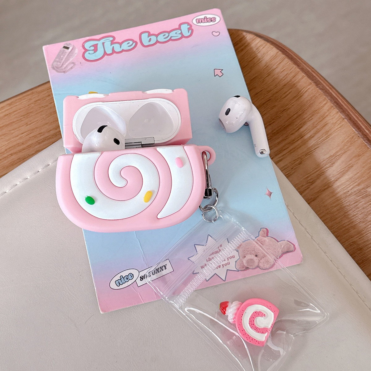 Pink Swiss Roll-shaped AirPods case - ChildAngle